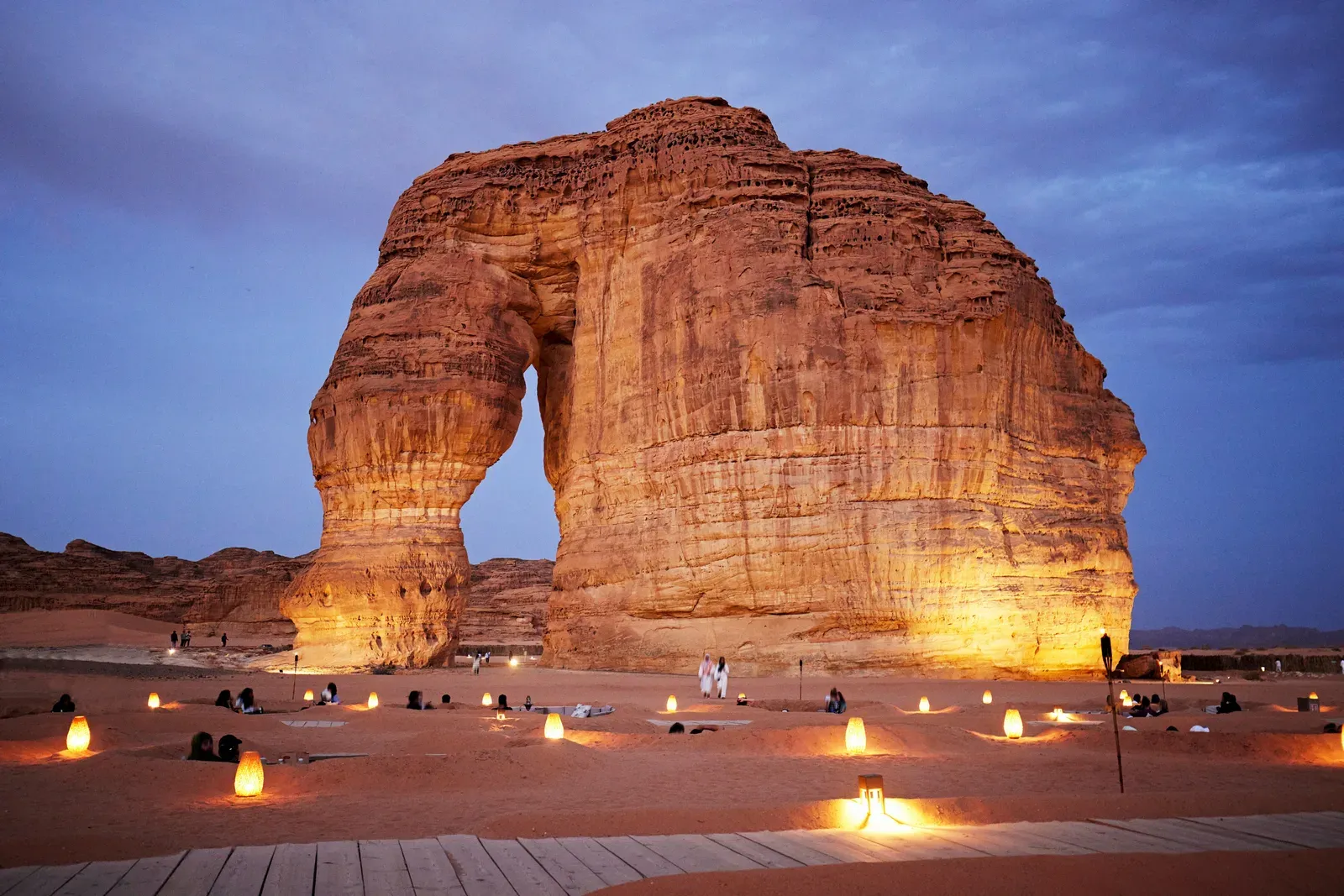 Gulf heritage — the Elephant Rock (Jabal AlFil) at AlUla, Saudi Arabia, lit at dusk with lanterns